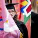 Laura Longman prepares to carry a flag before the start of the Michigan Spring Commencement on Saturday, May 4. Daniel Brenner I AnnArbor.com